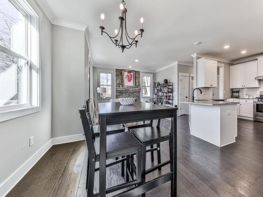 711 Carver Mill Road Talking Rock, GA 30175 - Photo 18 of 39 a dining room filled chandelier and wooden floor