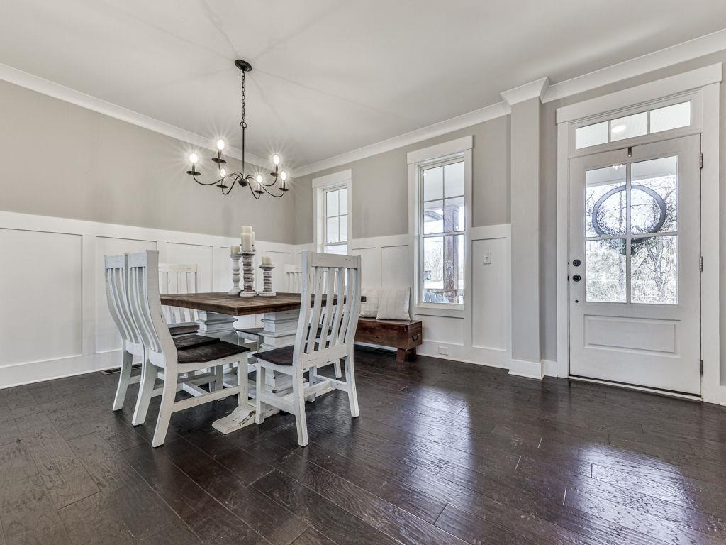 711 Carver Mill Road Talking Rock, GA 30175 - Photo 19 of 39 a view of a dining room with furniture wooden floor and chandelier