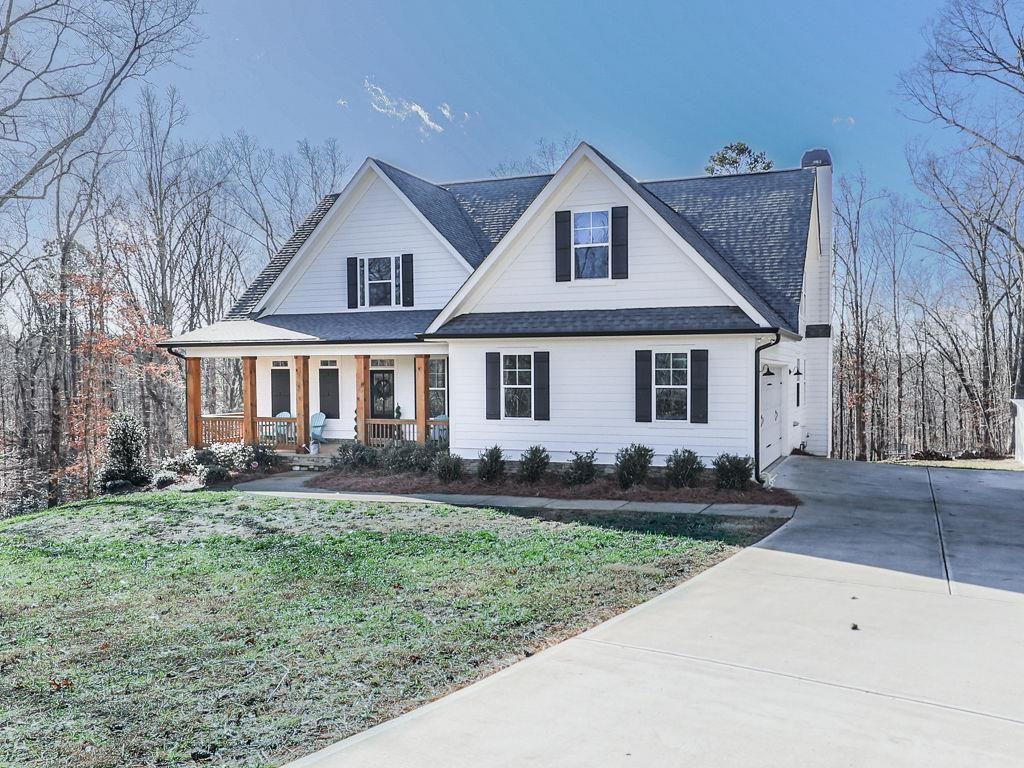 711 Carver Mill Road Talking Rock, GA 30175 - Photo 3 of 39 front view of a house and a yard