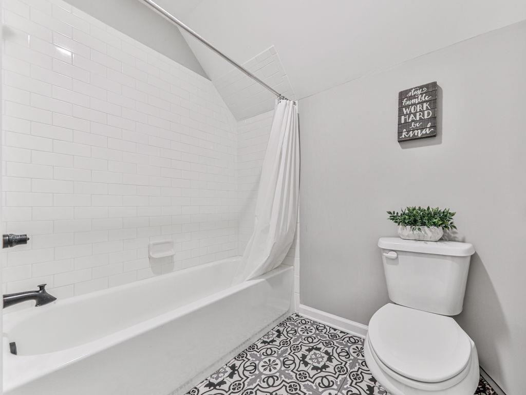 711 Carver Mill Road Talking Rock, GA 30175 - Photo 31 of 39 a white toilet sitting next to a bath tub