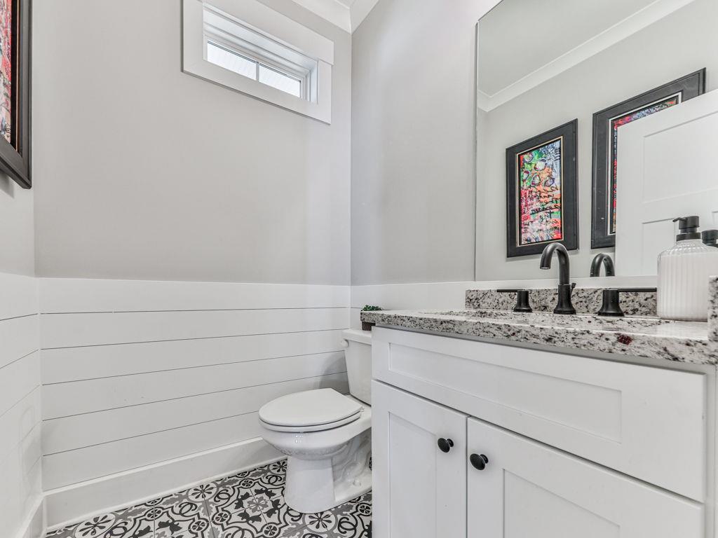 711 Carver Mill Road Talking Rock, GA 30175 - Photo 32 of 39 a bathroom with a granite countertop toilet sink and mirror