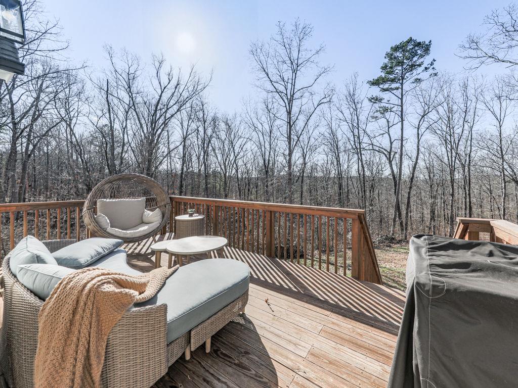 711 Carver Mill Road Talking Rock, GA 30175 - Photo 39 of 39 a balcony with a table and chairs