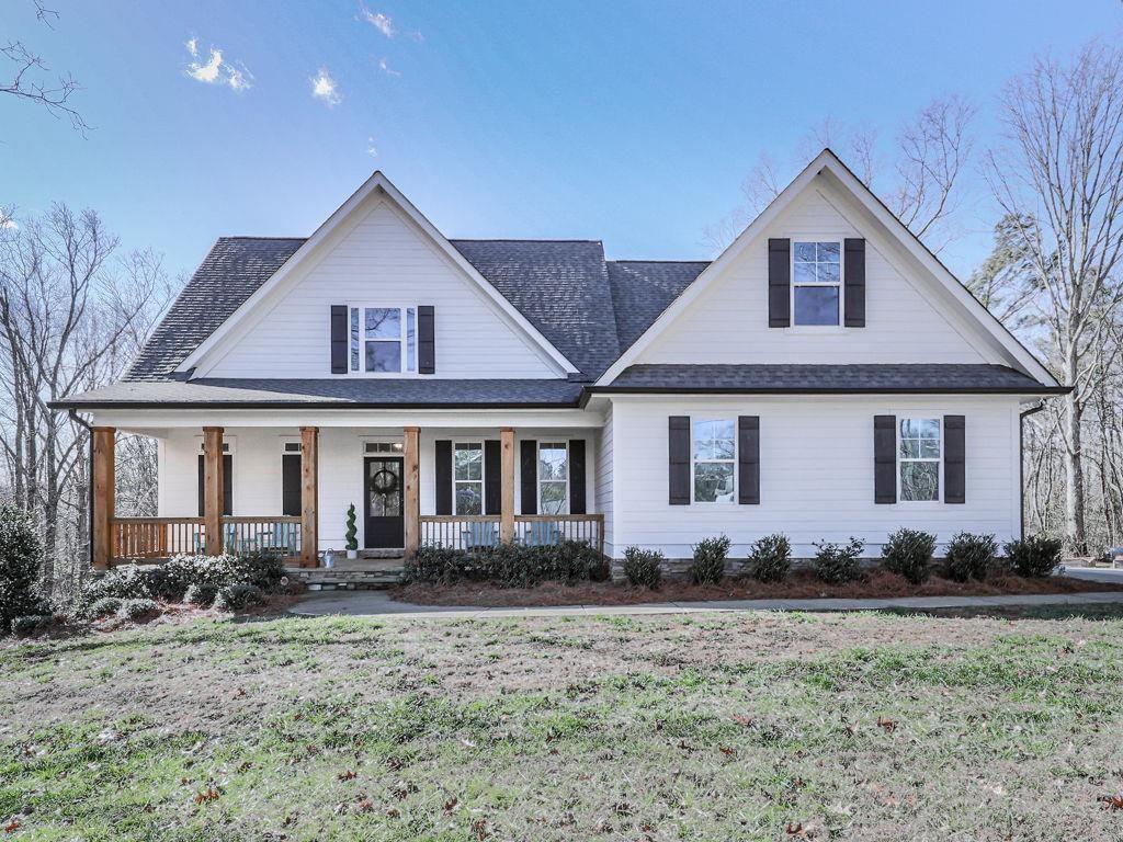 711 Carver Mill Road Talking Rock, GA 30175 - Photo 4 of 39 a front view of a house with garden