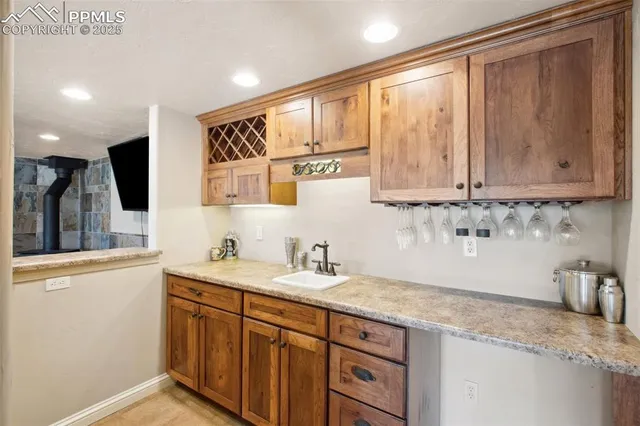 a kitchen with stainless steel appliances granite countertop a sink and cabinets