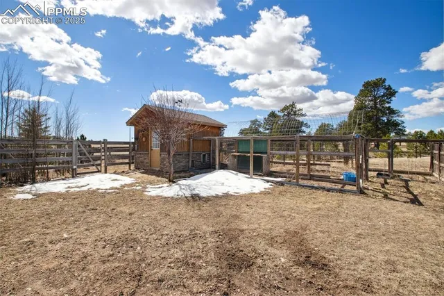 a view of a house with a snow in the yard