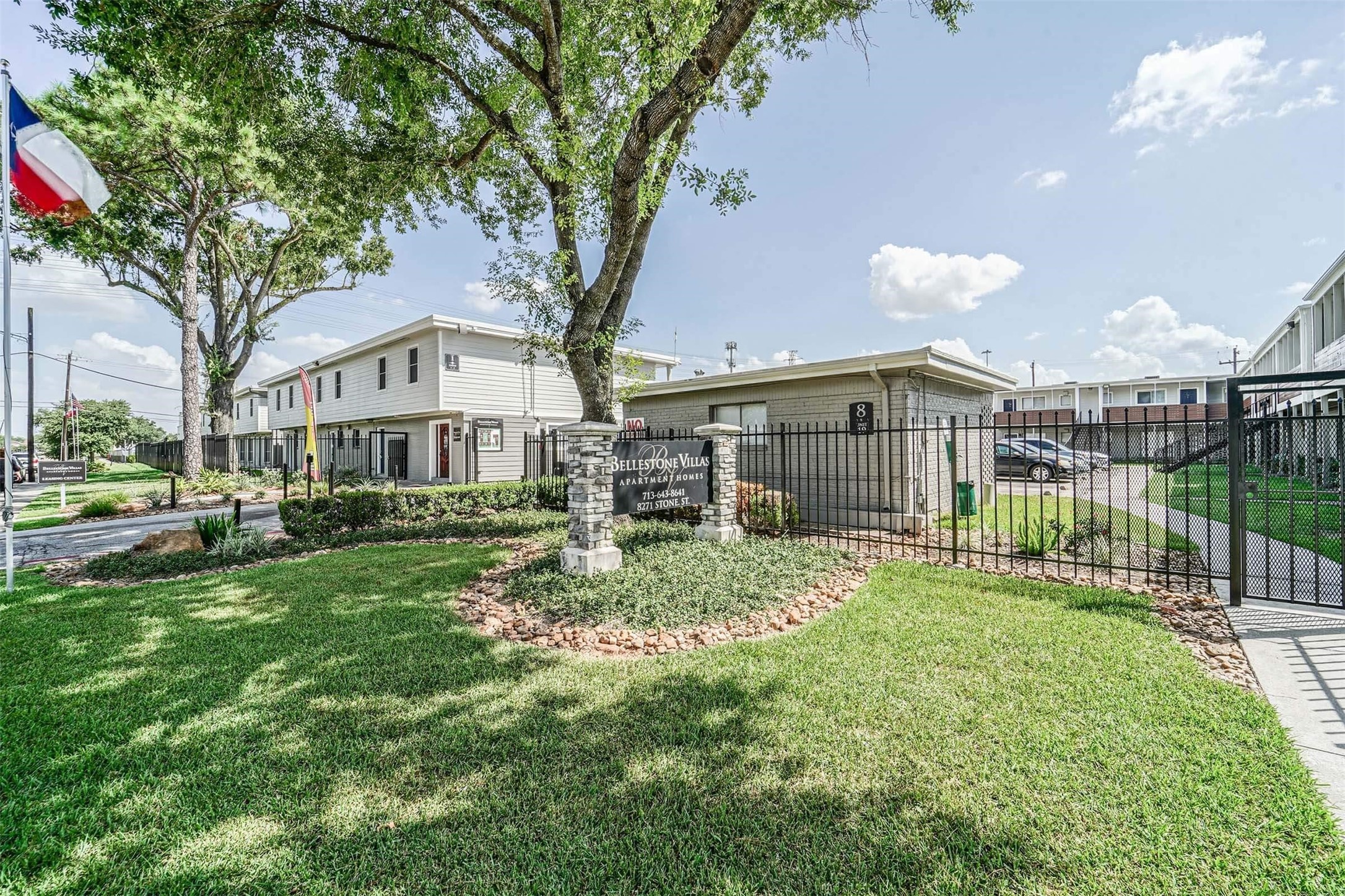 8271 Stone Street, Unit 7104 Houston, TX 77061 - Photo 14 of 28 a view of a yard in front of a house with a large tree