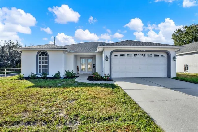 a front view of a house with garden
