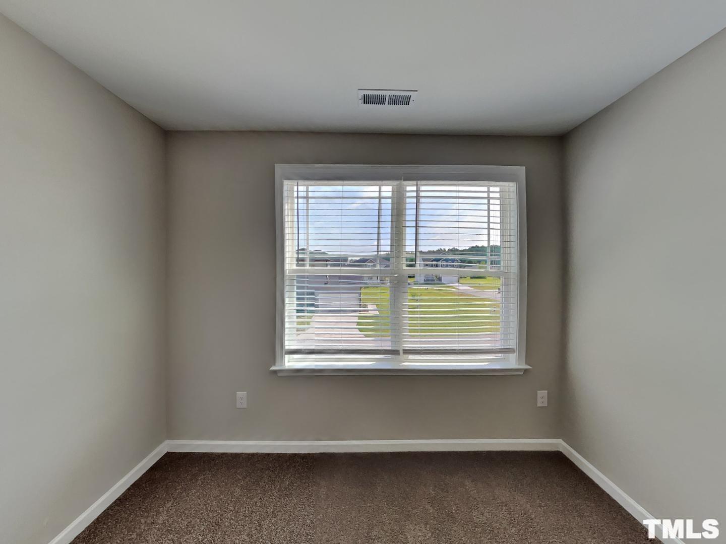106 Two Daughters Streme Smithfield, NC 27577 - Photo 11 of 16 an empty room with a window