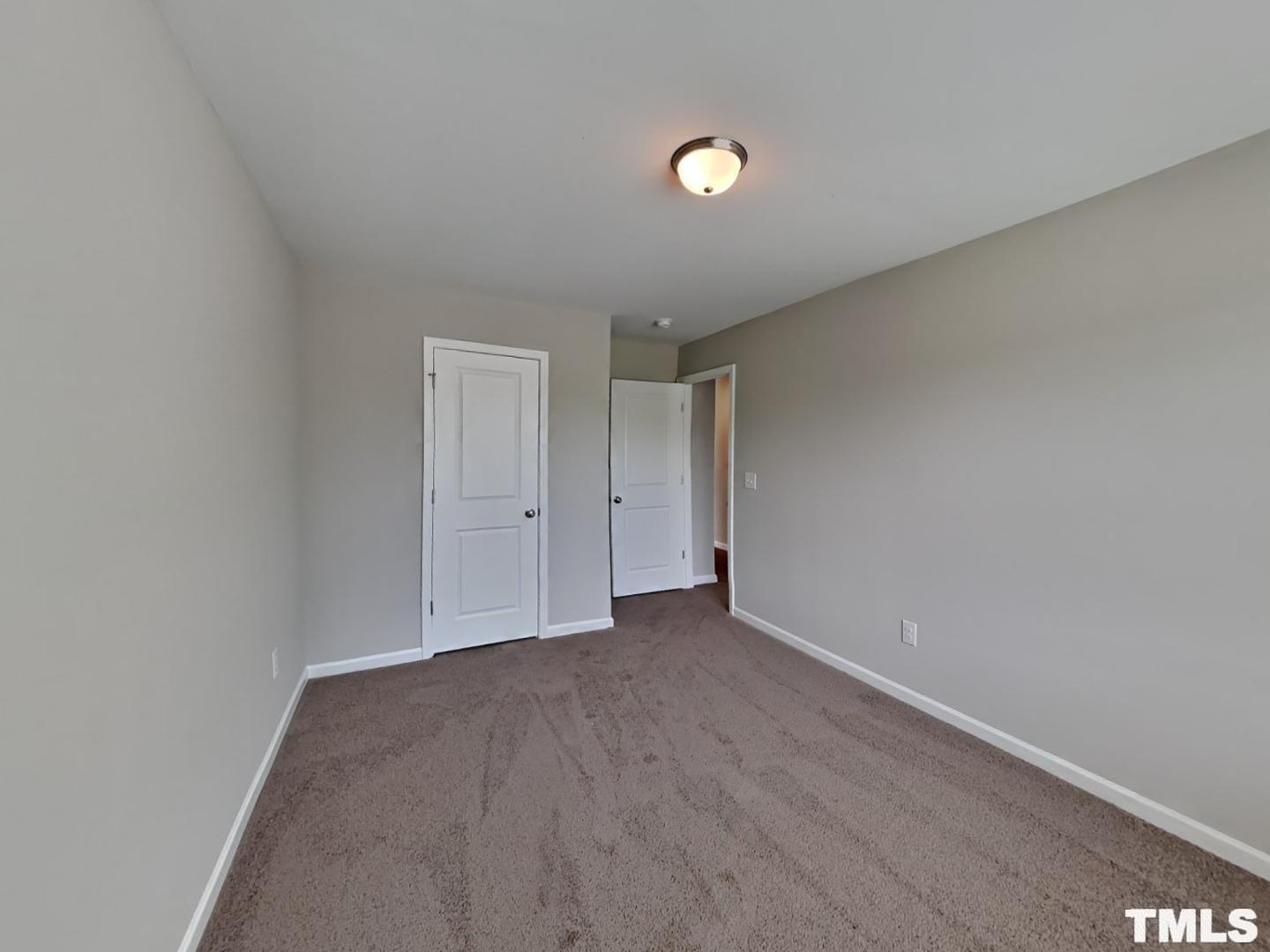 106 Two Daughters Streme Smithfield, NC 27577 - Photo 7 of 16 a view of an empty room and window