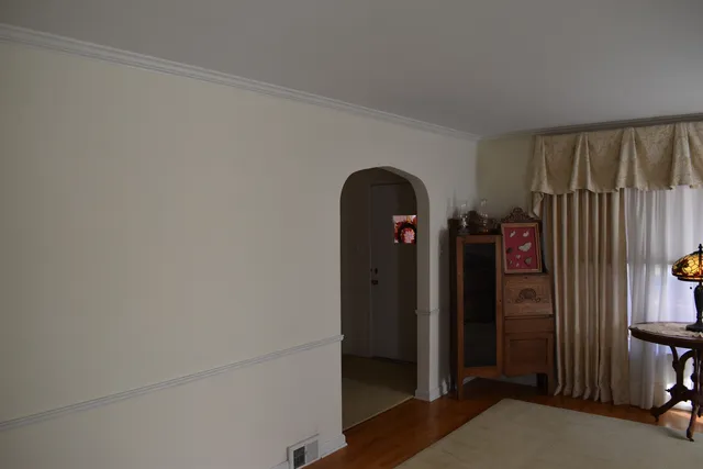 a view of a dining room with furniture and window