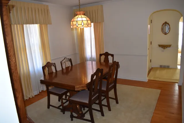 a view of a dining room with furniture and window