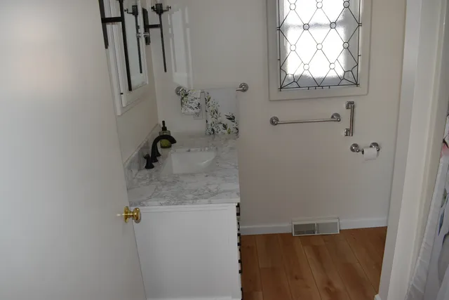 a white toilet sitting next to a sink