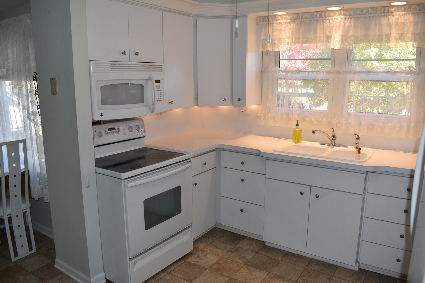 501 South Main Street Flanagan, IL 61740 - Photo 9 of 36 a kitchen with white cabinets and window