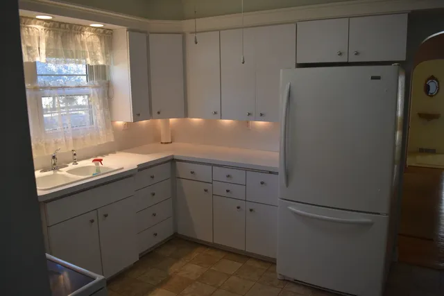 a kitchen with a sink and cabinets