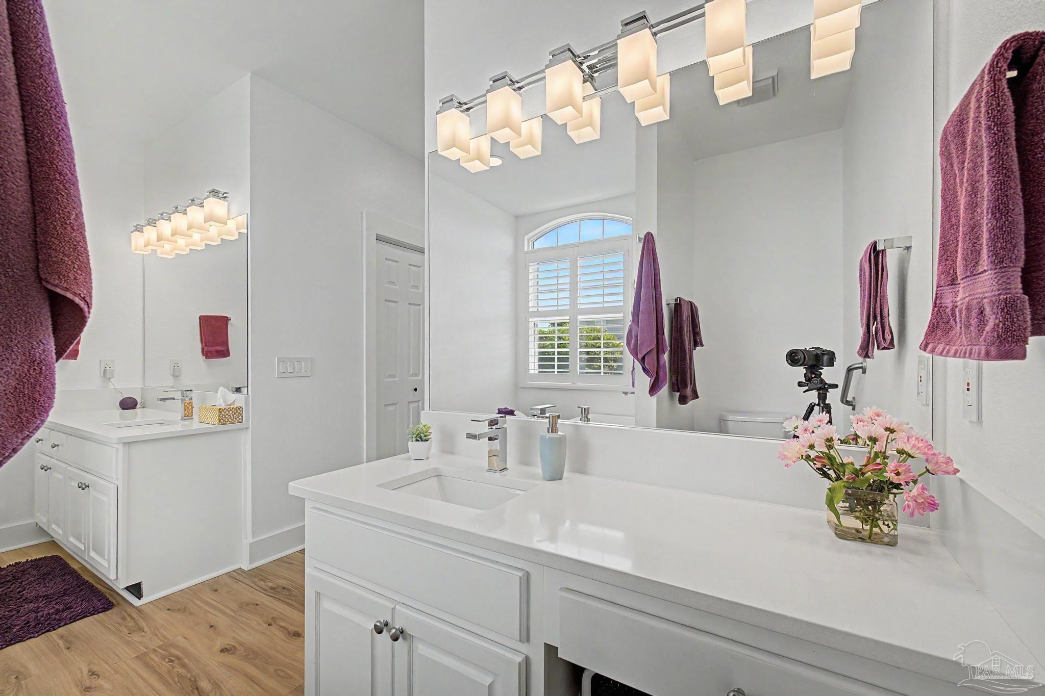 2005 Riviera Lane South Navarre, FL 32566 - Photo 25 of 70 a bathroom with a sink a vanity and a mirror