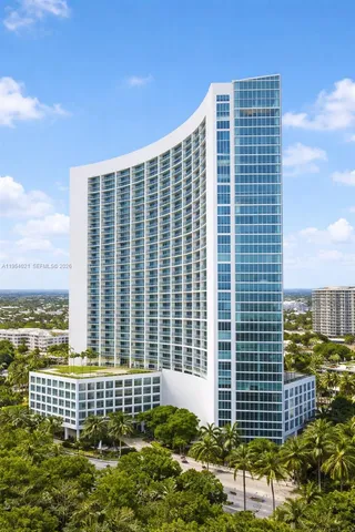a view of a swimming pool with outdoor seating