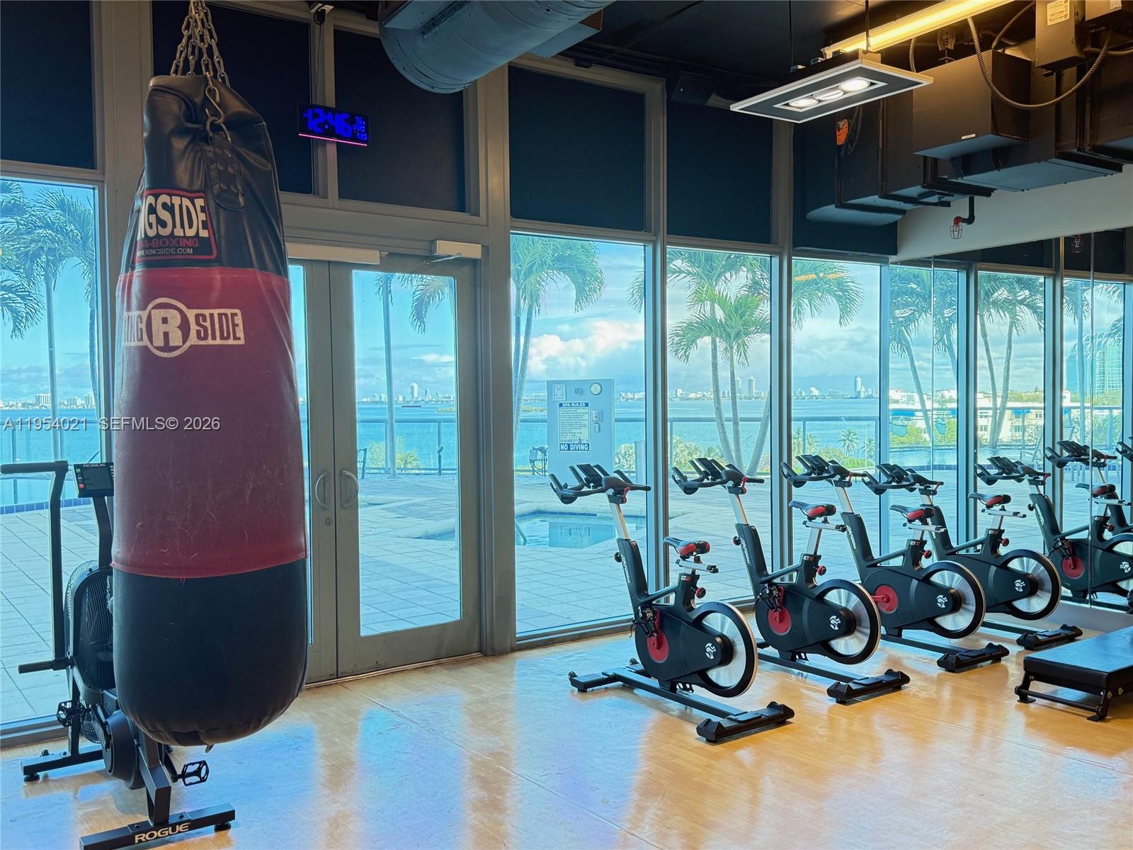 601 Northeast 36th Street, Unit 1112 Miami, FL 33137 - Photo 29 of 32 a view of a room with gym equipment