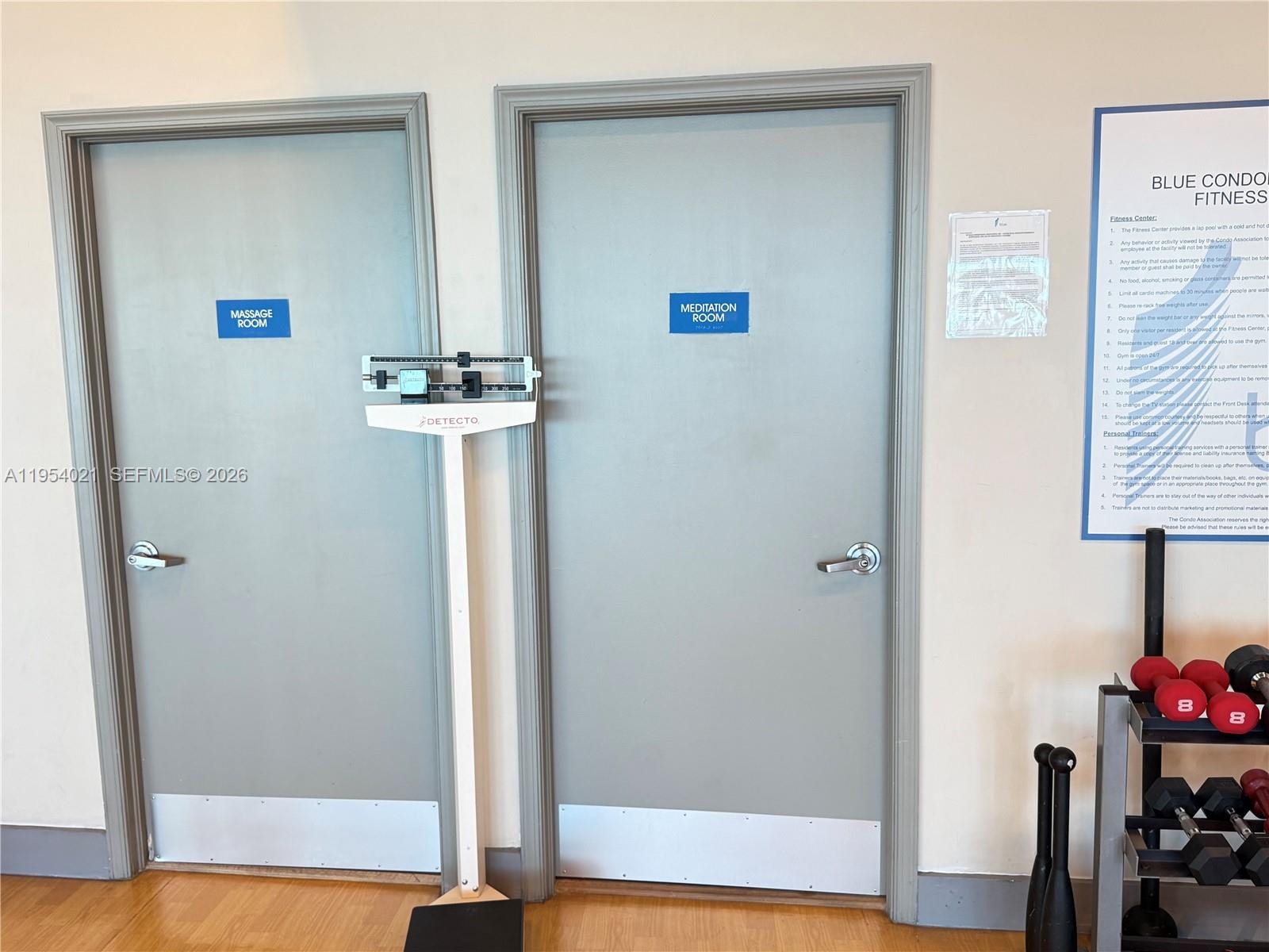 601 Northeast 36th Street, Unit 1112 Miami, FL 33137 - Photo 32 of 32 a view of a room with wooden floor and cabinet