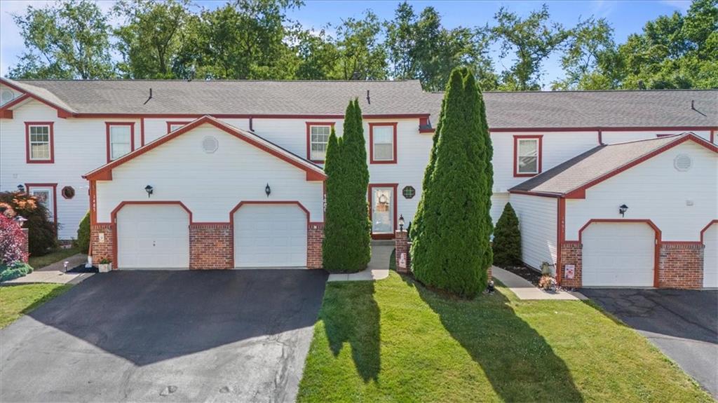 1489 Yorktown Drive Lawrence, PA 15055 - Photo 1 of 37 a view of a white house with a yard plants and large tree