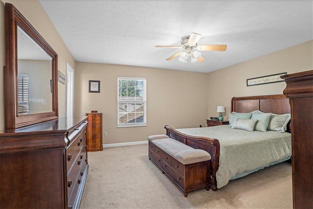 1489 Yorktown Drive Lawrence, PA 15055 - Photo 20 of 37 a bedroom with a bed and a chandelier