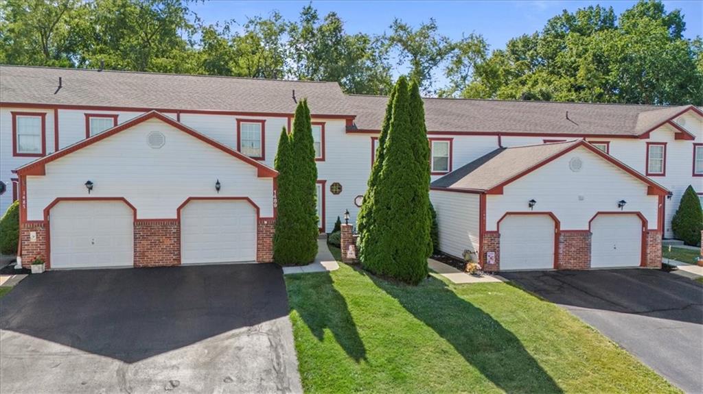 1489 Yorktown Drive Lawrence, PA 15055 - Photo 2 of 37 a view of a white house with a small yard and large tree