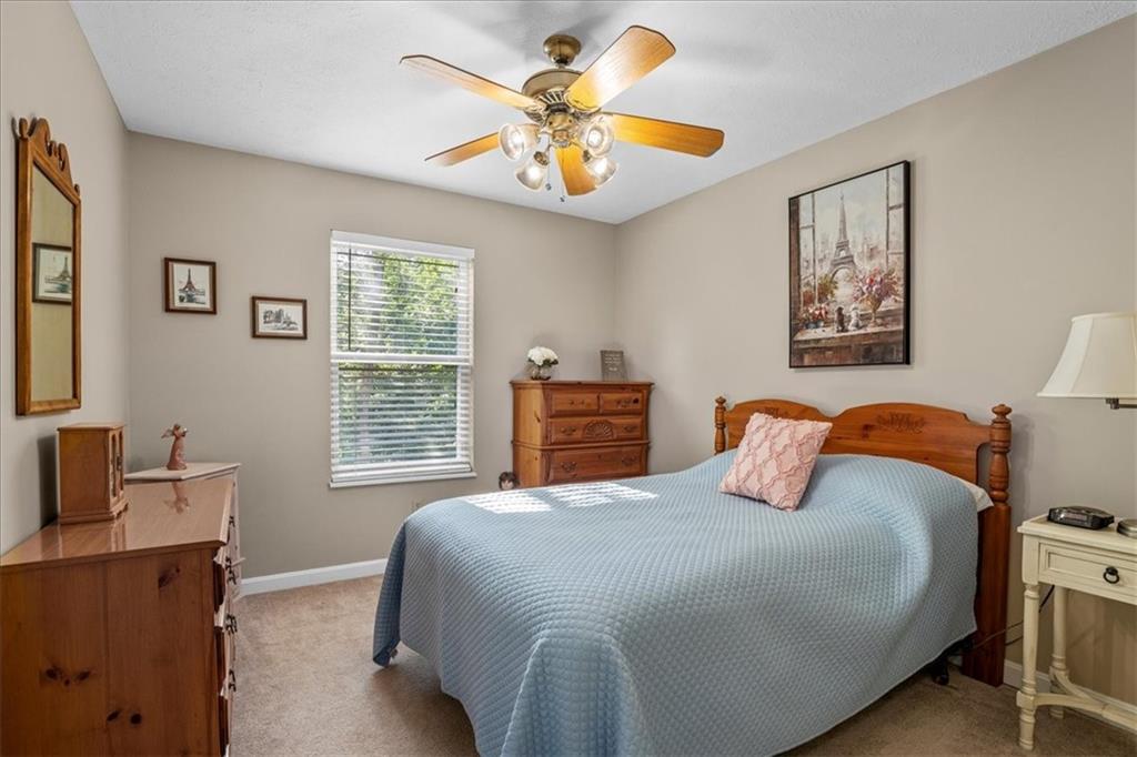 1489 Yorktown Drive Lawrence, PA 15055 - Photo 26 of 37 a bedroom with a bed and a chandelier