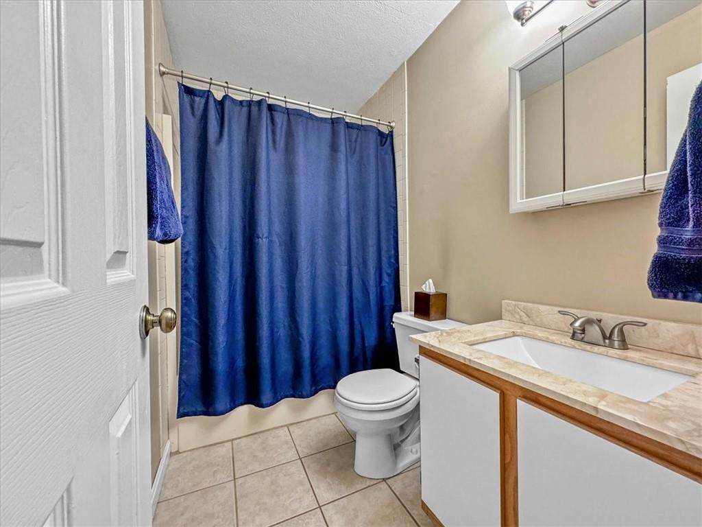 1489 Yorktown Drive Lawrence, PA 15055 - Photo 28 of 37 a bathroom with a sink a toilet and shower curtain