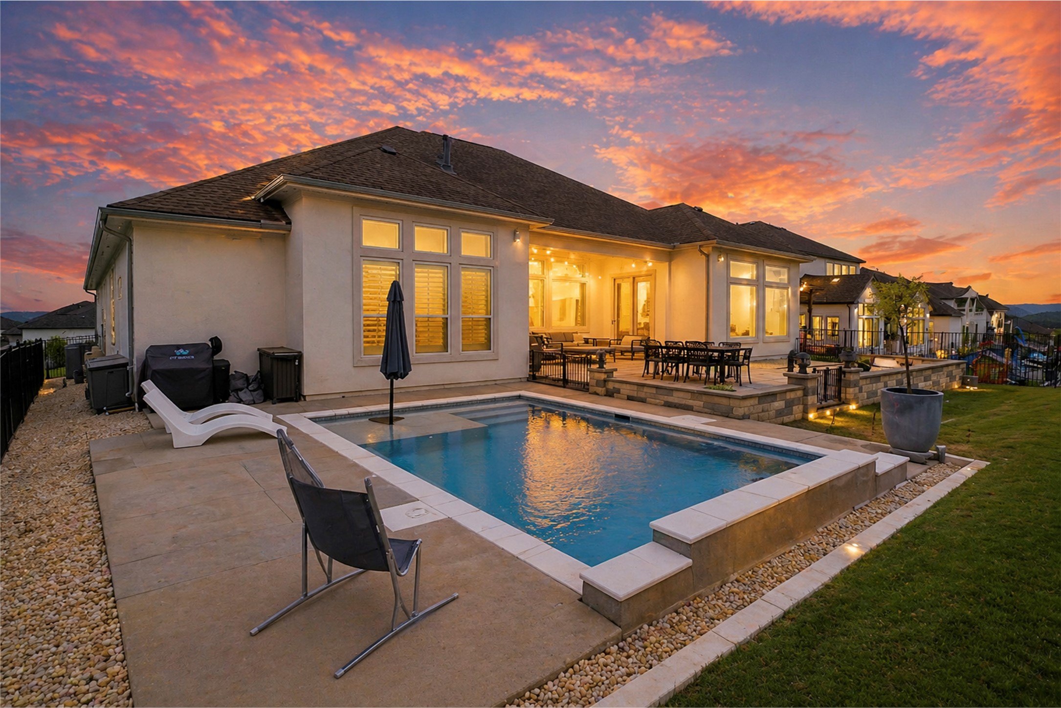 4513 Vieste View Leander, TX 78641 - Photo 5 of 40 Rear exterior featuring a rectangular pool with integrated steps, an expansive patio, and a terraced lawn