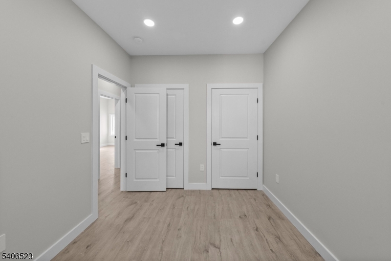 404 Washington Street Perth Amboy, NJ 08861 - Photo 16 of 45 wooden floor in an empty room