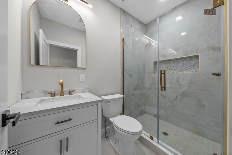 404 Washington Street Perth Amboy, NJ 08861 - Photo 21 of 45 a bathroom with a sink toilet and shower