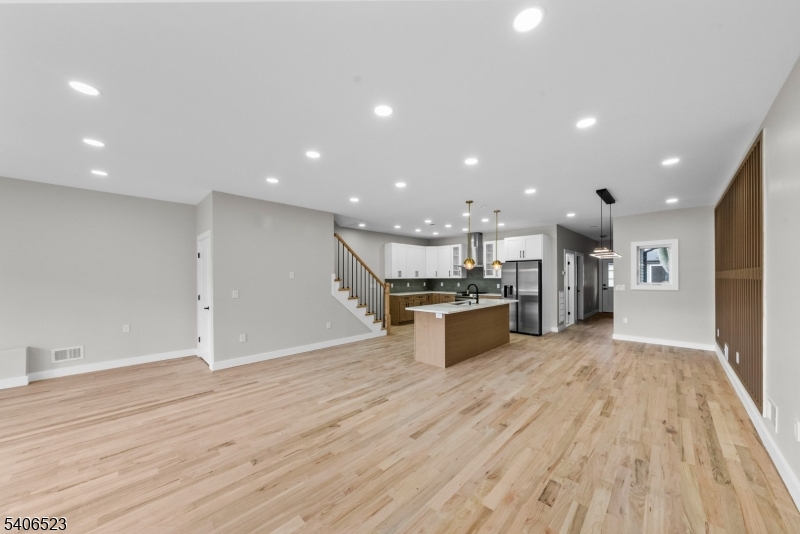 404 Washington Street Perth Amboy, NJ 08861 - Photo 26 of 45 a view of kitchen with kitchen island wooden floor center island and stainless steel appliances
