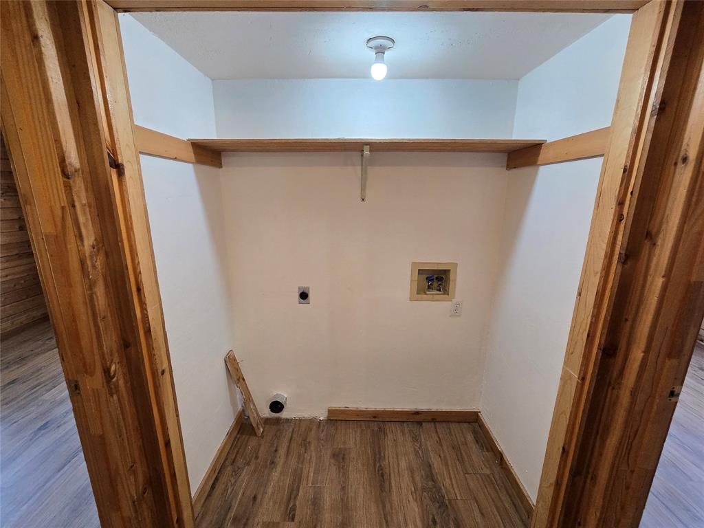 3505 Farmer Road Azle, TX 76020 - Photo 34 of 40 Utility closet downstairs, between bedrooms, has a shelf and its own light.