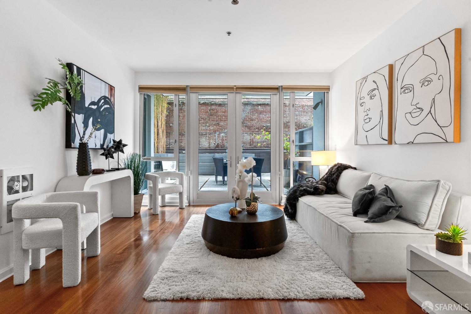 200 2nd Street, Unit 103 Oakland, CA 94607 - Photo 1 of 31 a living room with furniture and a large window