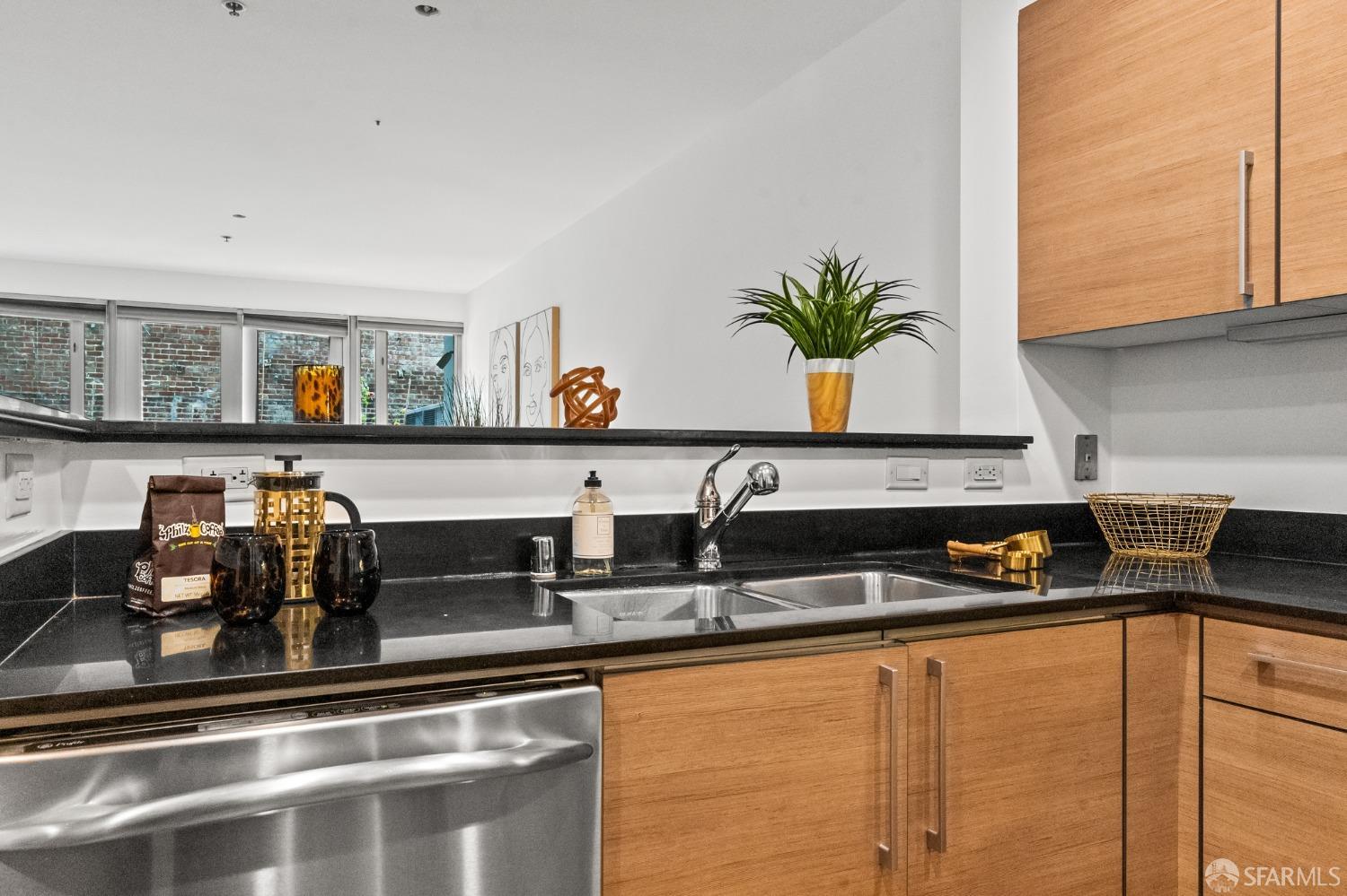 200 2nd Street, Unit 103 Oakland, CA 94607 - Photo 16 of 31 a kitchen with a sink and cabinets