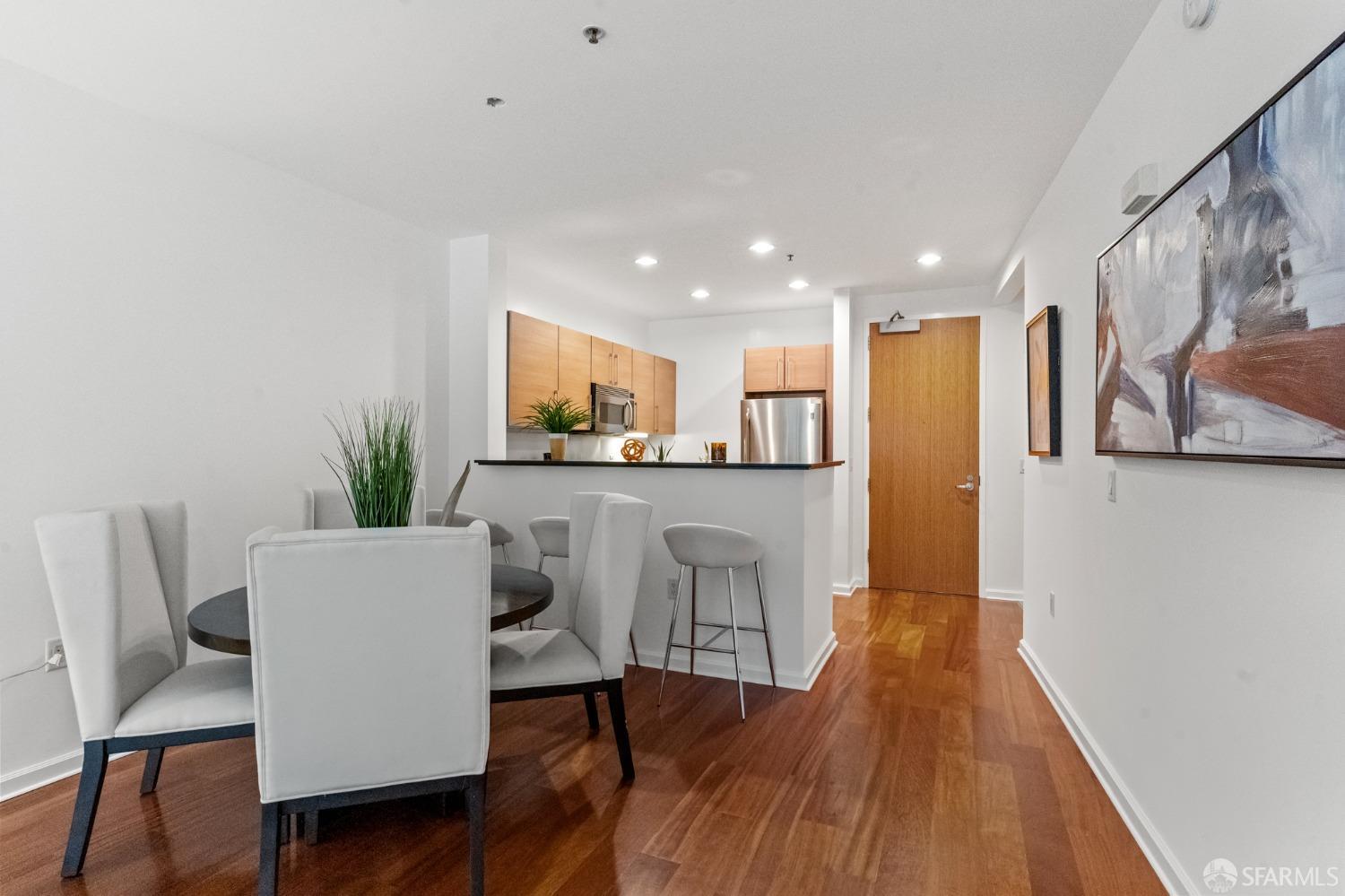 200 2nd Street, Unit 103 Oakland, CA 94607 - Photo 20 of 31 a living room with furniture and kitchen view