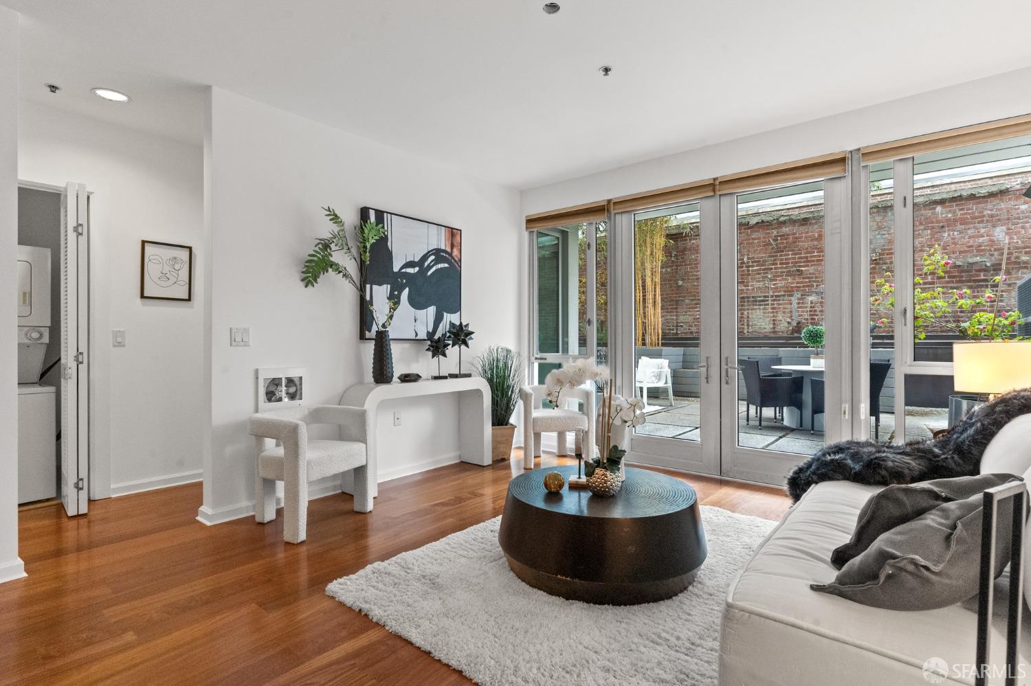 200 2nd Street, Unit 103 Oakland, CA 94607 - Photo 22 of 31 a living room with furniture and a large window
