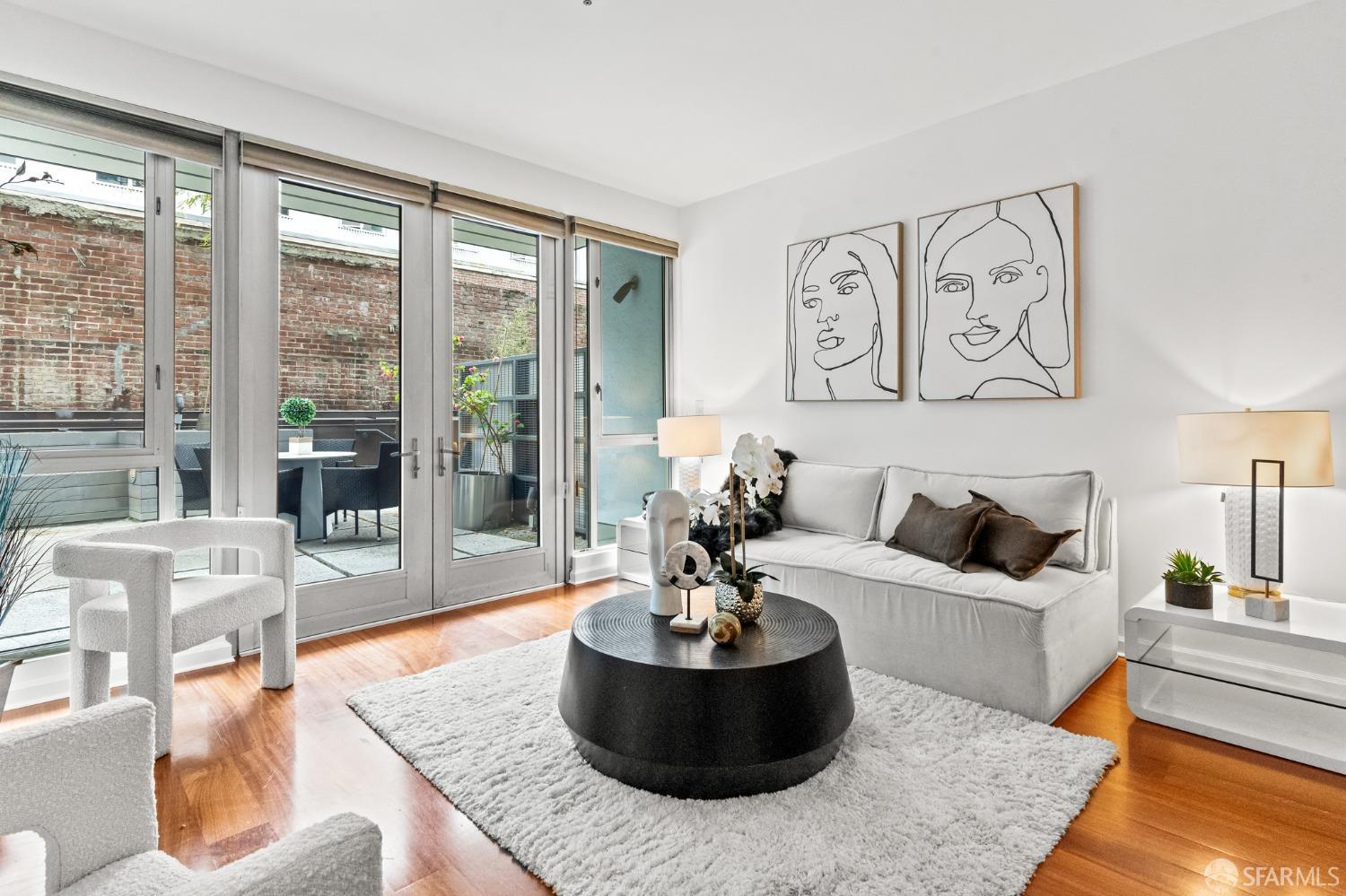 200 2nd Street, Unit 103 Oakland, CA 94607 - Photo 25 of 31 a living room with furniture and a large window