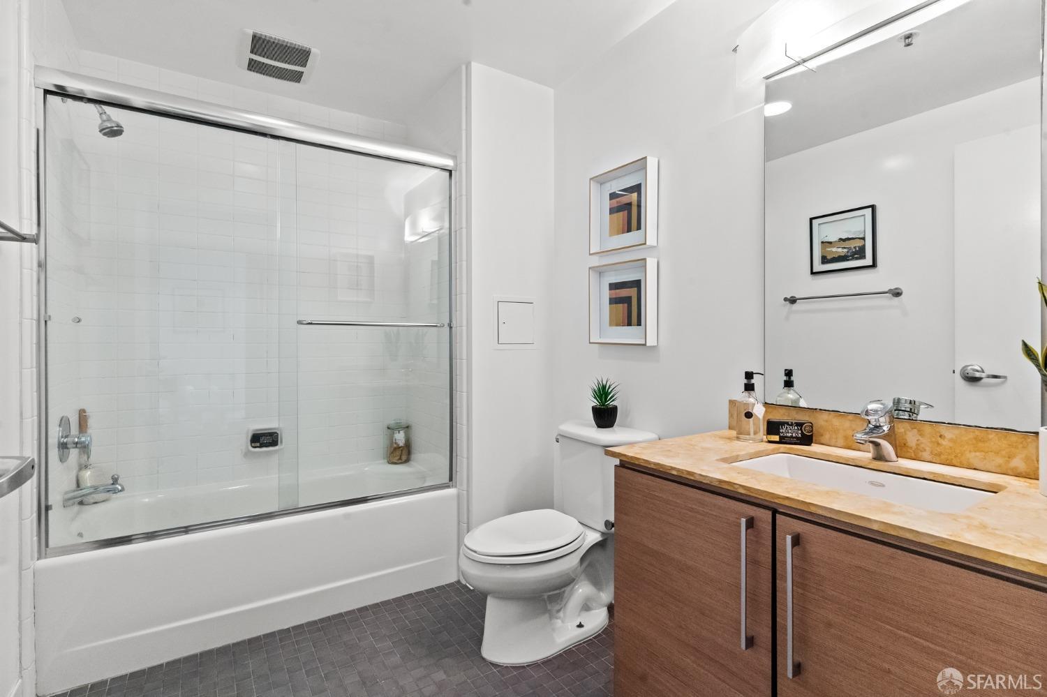 200 2nd Street, Unit 103 Oakland, CA 94607 - Photo 10 of 31 a bathroom with a sink toilet and shower