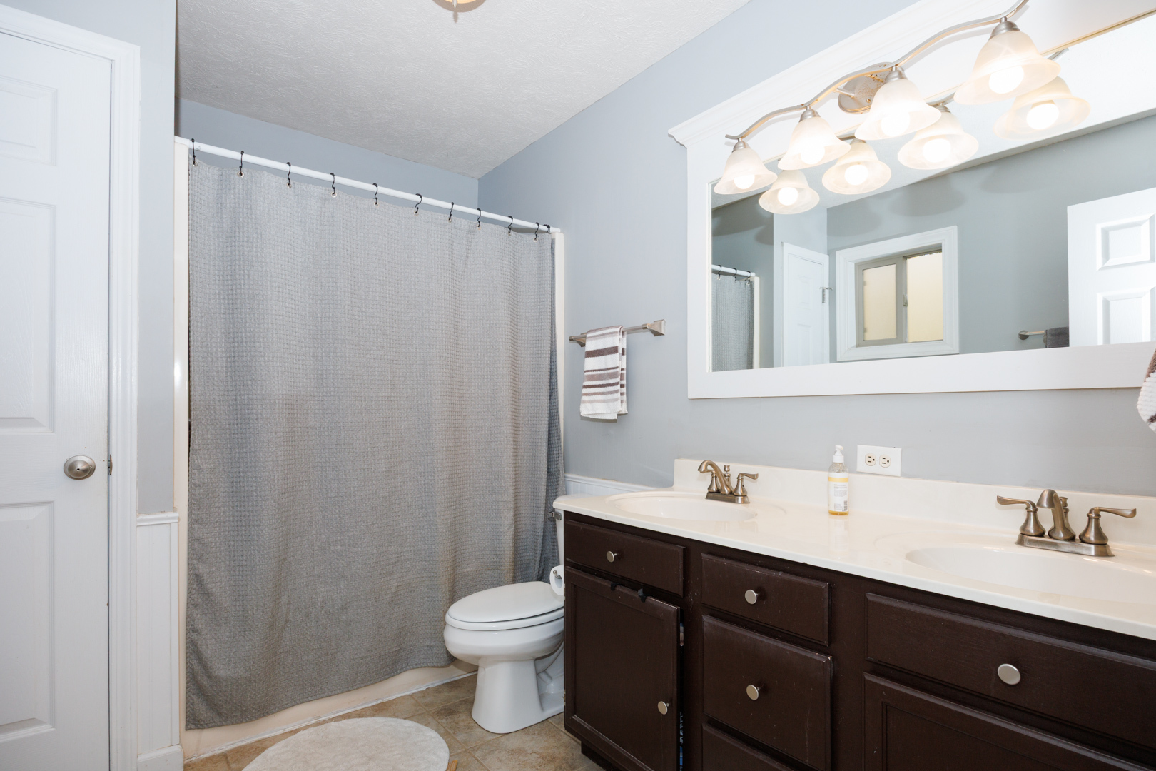 303 South Madison Street Towanda, IL 61776 - Photo 22 of 48 a bathroom with a sink vanity granite and toilet