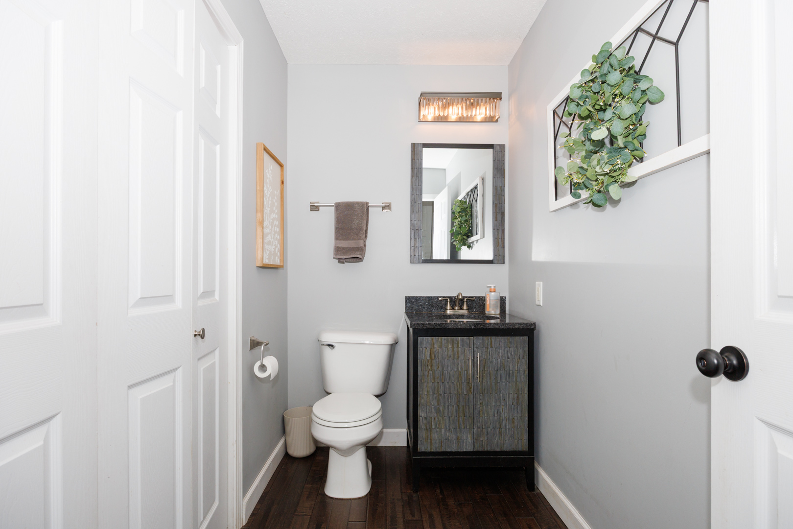 303 South Madison Street Towanda, IL 61776 - Photo 23 of 48 a white toilet sitting next to a bathroom sink