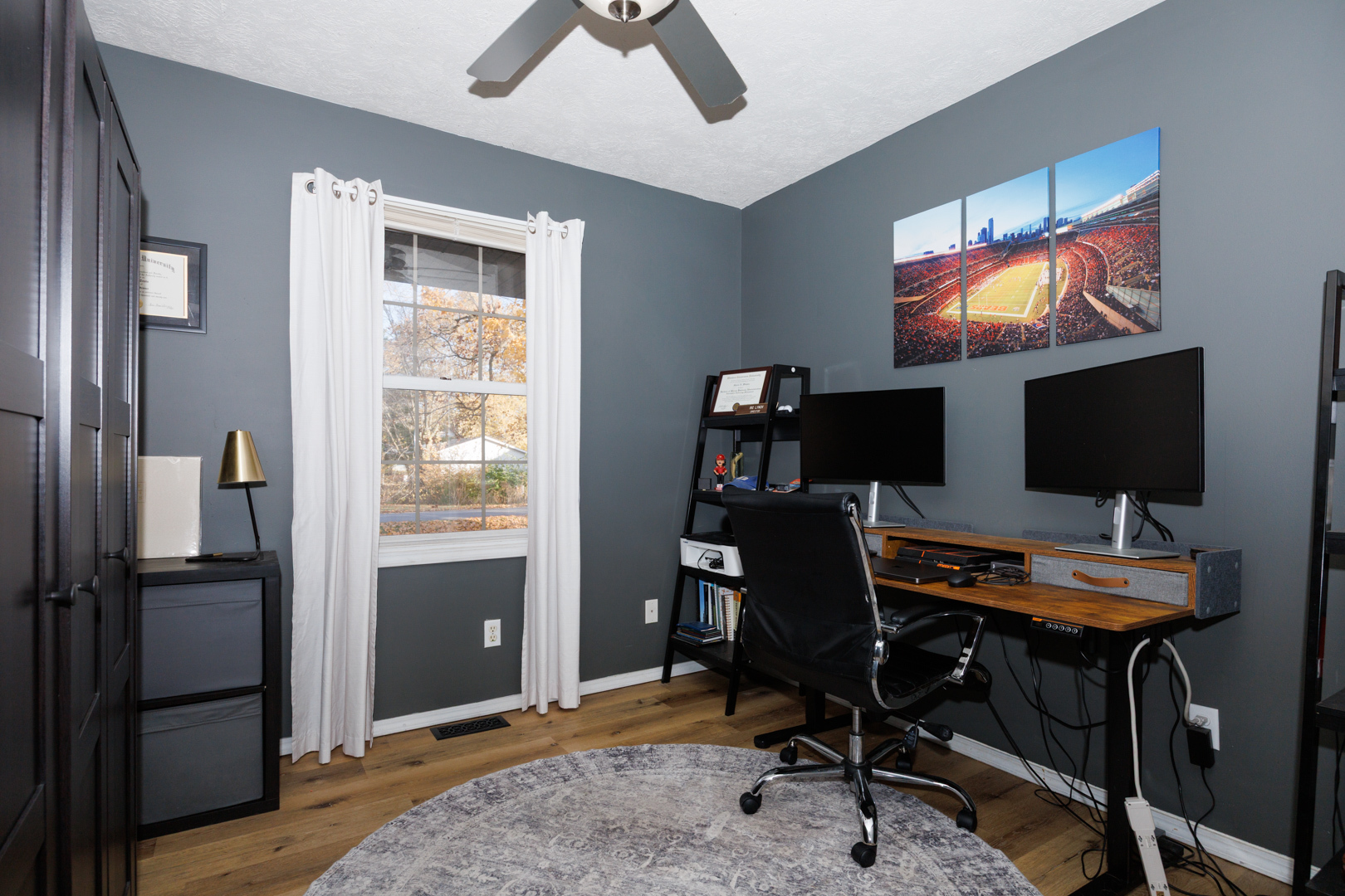 303 South Madison Street Towanda, IL 61776 - Photo 27 of 48 a view of a workspace with furniture and a flat screen tv