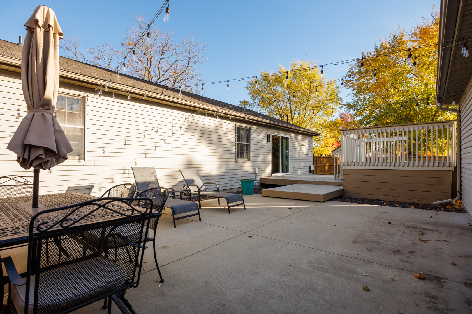 303 South Madison Street Towanda, IL 61776 - Photo 32 of 48 a view of a patio with table and chairs and potted plants
