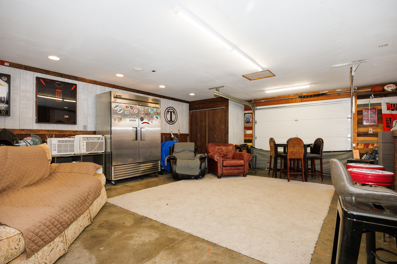 303 South Madison Street Towanda, IL 61776 - Photo 40 of 48 a living room with furniture a window and gym equipment