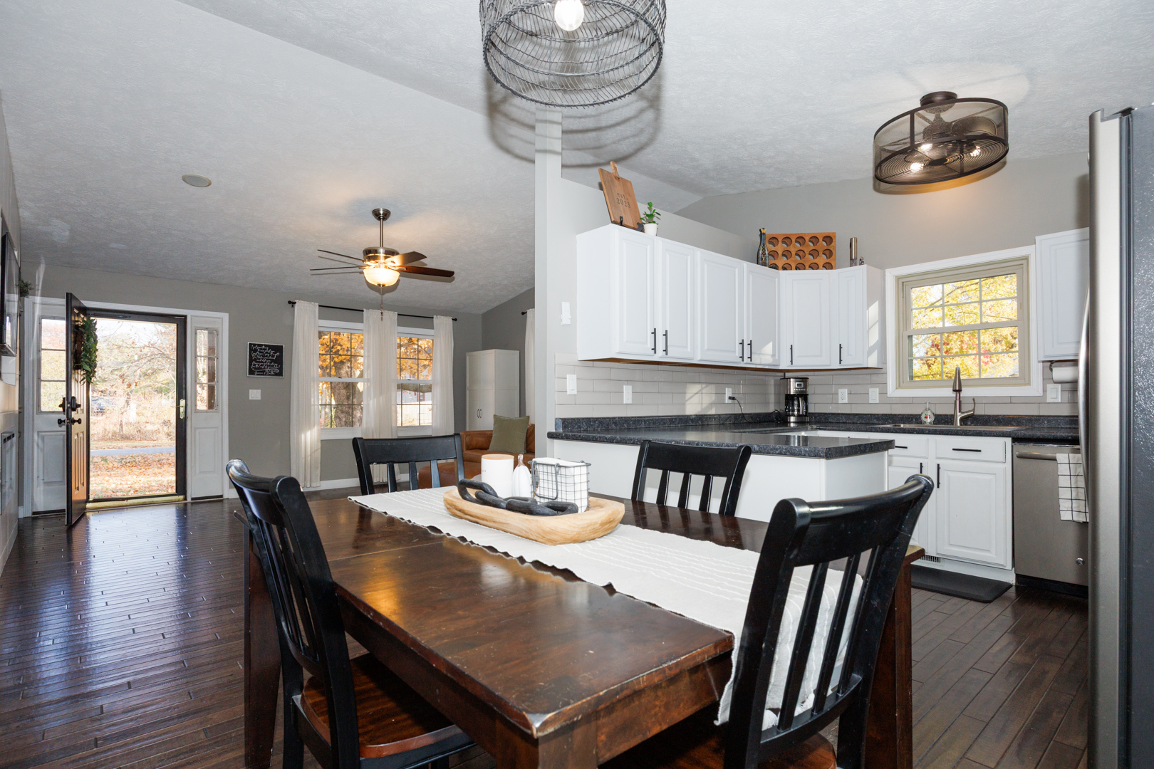 303 South Madison Street Towanda, IL 61776 - Photo 9 of 48 a kitchen with a dining table chairs and kitchen view