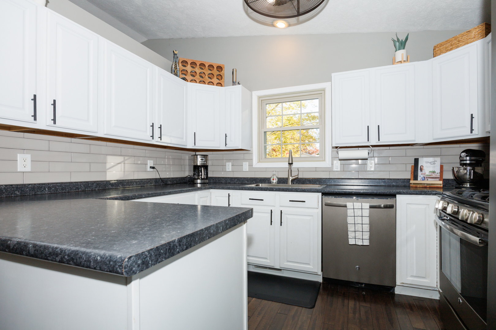 303 South Madison Street Towanda, IL 61776 - Photo 10 of 48 a kitchen with granite countertop stainless steel appliances a sink stove and cabinets