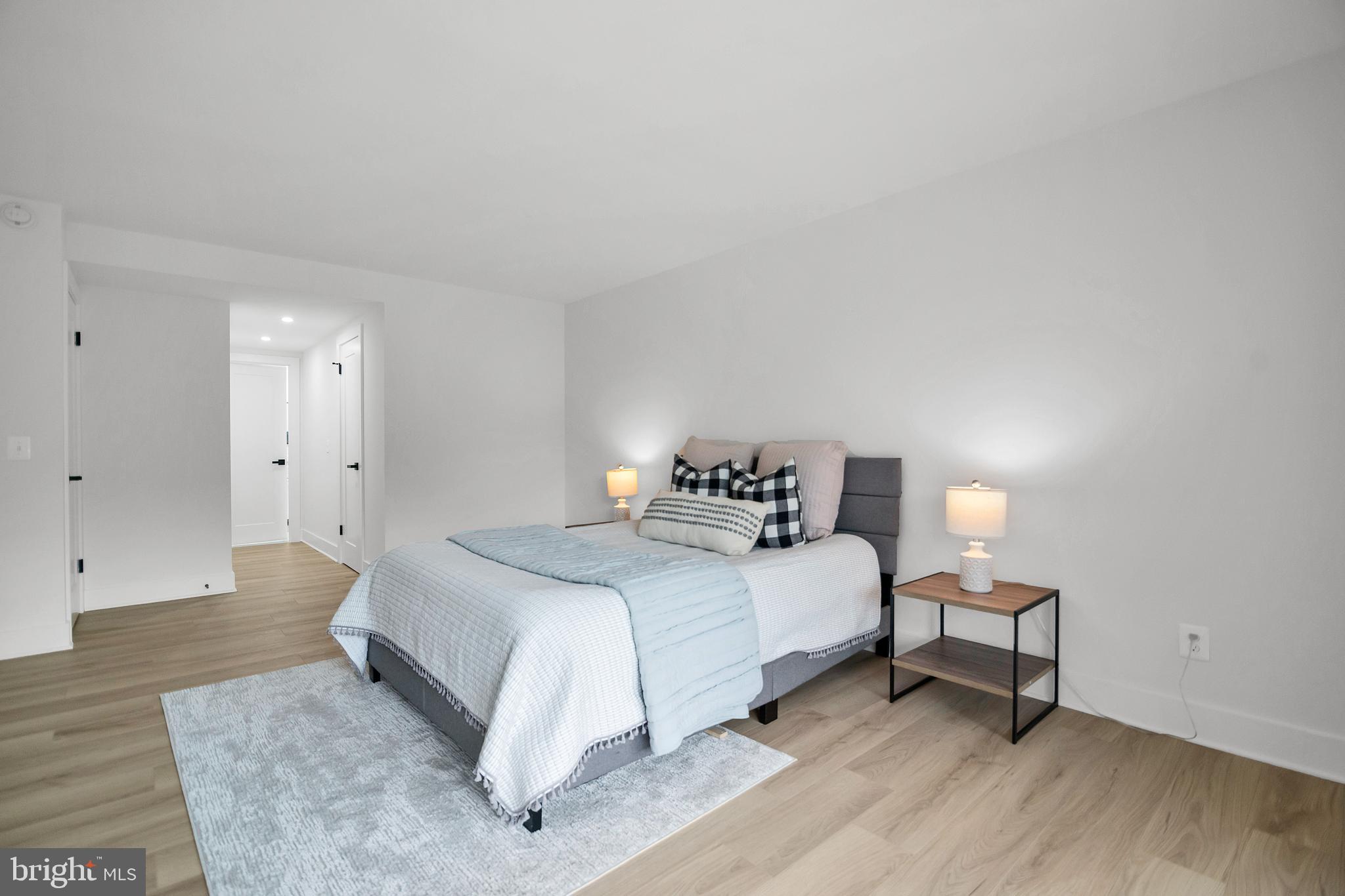 6101 Edsall Road, Unit 602 Alexandria, VA 22304 - Photo 14 of 31 a bedroom with a bed and a table