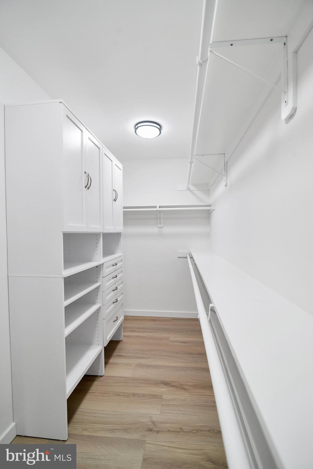 6101 Edsall Road, Unit 602 Alexandria, VA 22304 - Photo 15 of 31 a view of a hallway with wooden floor and staircase