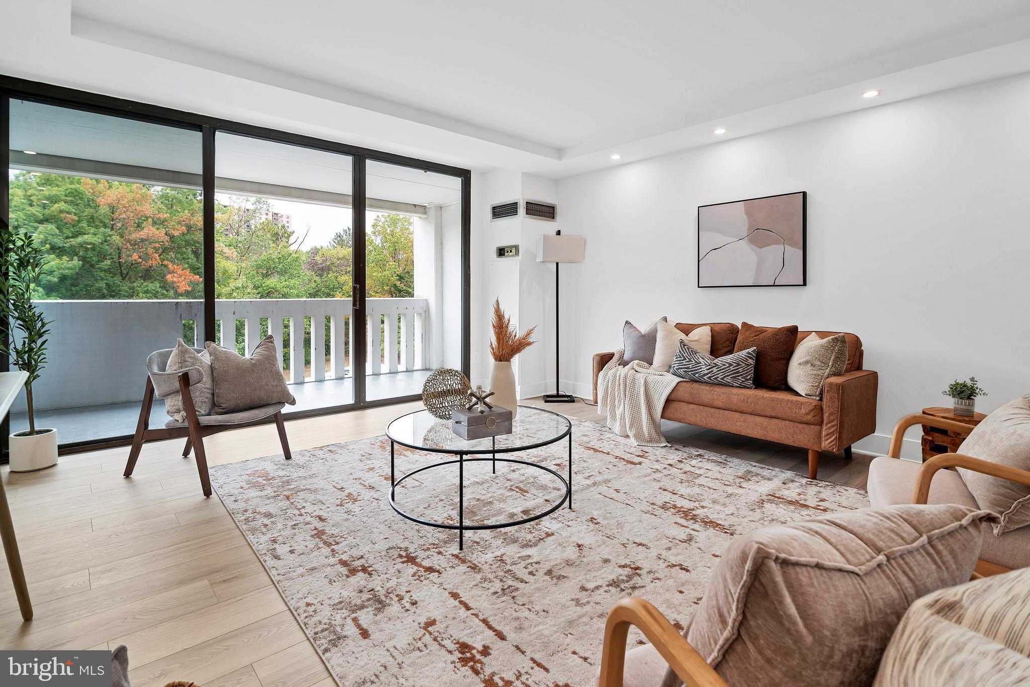 6101 Edsall Road, Unit 602 Alexandria, VA 22304 - Photo 2 of 31 a living room with furniture and a large window