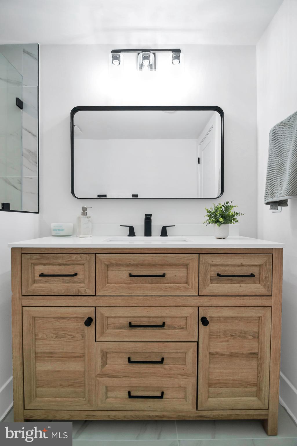 6101 Edsall Road, Unit 602 Alexandria, VA 22304 - Photo 24 of 31 a bathroom with a sink and a mirror