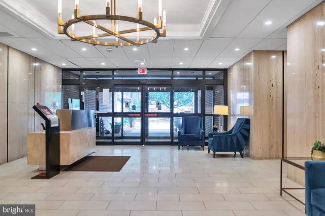 a view of kitchen with refrigerator and window